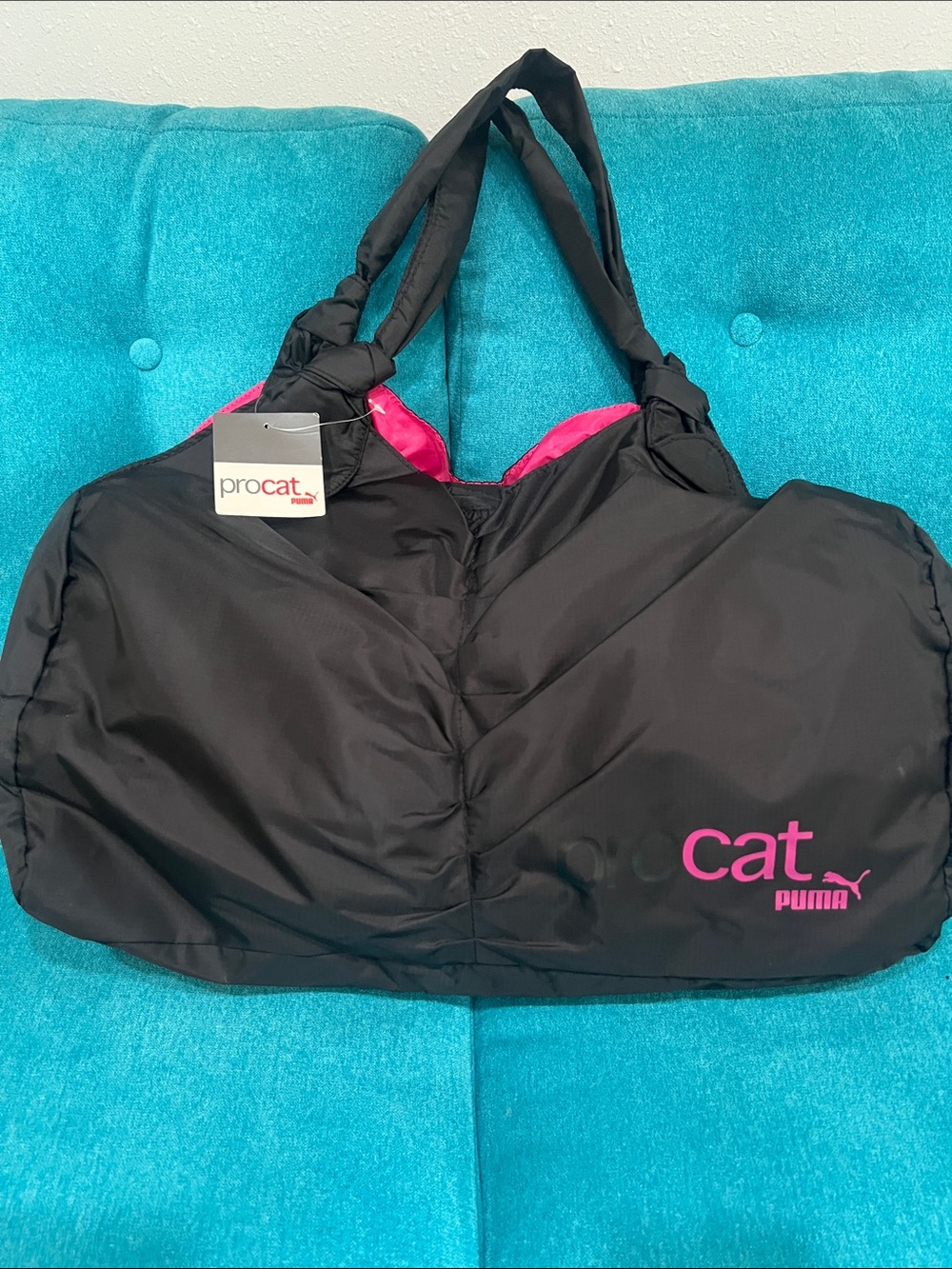 Puma black tote with pink logo and accents